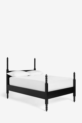 Cutout image of the Folk Bobbin Bed on a white background.