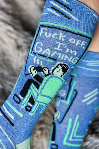 Close-up of the Fuck Off, I'm Gaming Mens Socks being worn by a model.