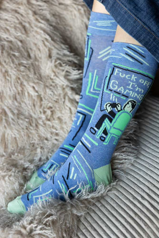 The Fuck Off, I'm Gaming Mens Socks being worn by a model.