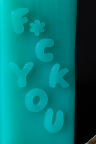 Detail shot of the text on the Fuck You Candle.