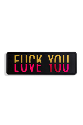 Cutout of the Fuck vs Love You Wall Sign on a white background.