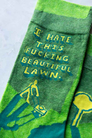 Close-up of the text on the Fucking Beautiful Lawn Men's Socks.