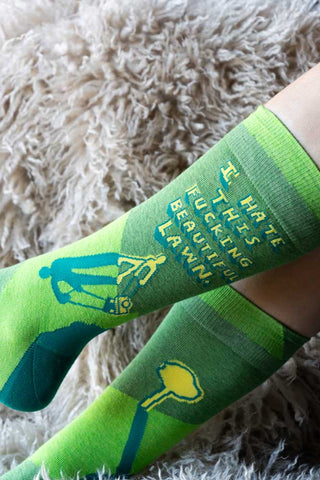 Close-up of the Fucking Beautiful Lawn Men's Socks being worn by a model.