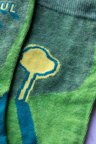 Detail shot of the design of the Fucking Beautiful Lawn Men's Socks.