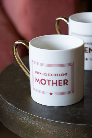 A statement mug styled on a black textured table 