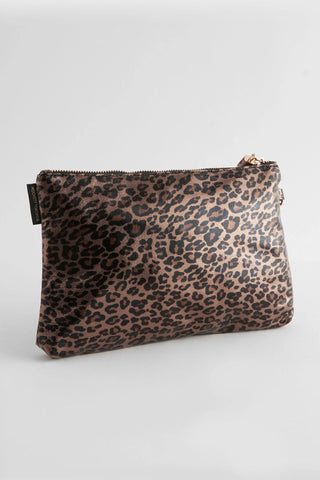 The Glam Leopard Print Clutch Bag in front of a plain background.