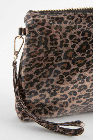 Close-up of the corner and wrist strap of the Glam Leopard Print Clutch Bag.