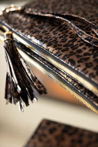 Close-up of the zip and strap on the Glam Leopard Print Clutch Bag.