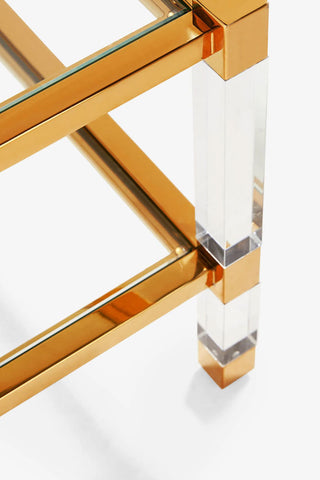 Detail shot of the Gold & Glass Coffee Table on a white background.