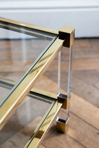 Detail shot of one corner of the Gold & Glass Coffee Table.