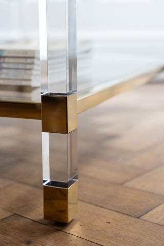 Detail shot of one of the legs of the Gold & Glass Coffee Table.