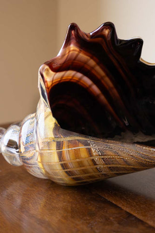 Close-up image of the Glass Conch Shell Paperweight Ornament.