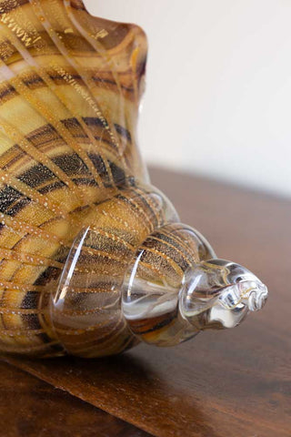 Detail image of the end of the Glass Conch Shell Paperweight Ornament.