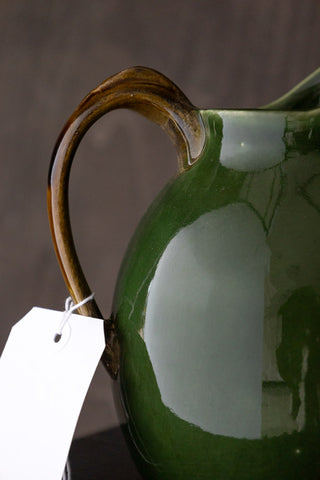 The brown jug arm with an outlet label.