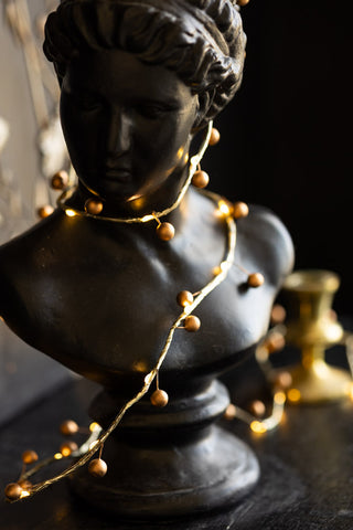 Gold Berry Decorative Light Chain wrapped around bust