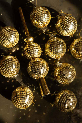 A lifestyle image of the Gold Disco Ball Christmas Tree Decoration as a set