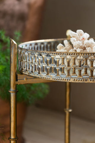 Detail shot of the side of the Gold Distressed Mirrored Side Table.