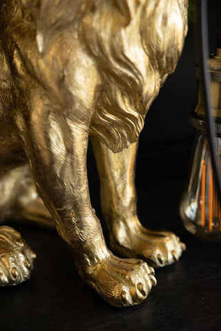 Close-up of the feet on the Quirky Gold Lion Lamp.