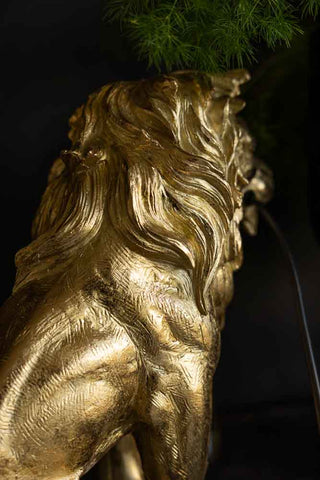 Close-up of the Quirky Gold Lion Lamp, seen from the back.