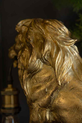 Close-up of the Quirky Gold Lion Lamp, seen from an angle.