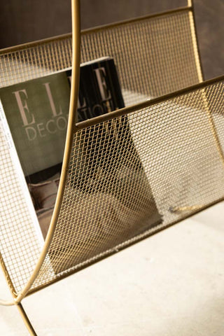 Gold Magazine Rack With Glass Top styled with magazine