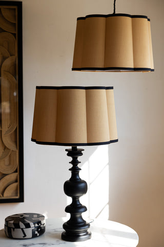 Two Gold Scalloped Easyfit Lampshades, one styled on a lamp base on a marble table with a trinket box and the other hanging as a pendant light.