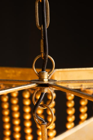 Detail shot of the hook/chain on the Gold Star Shaped Beaded Statement Chandelier Light.