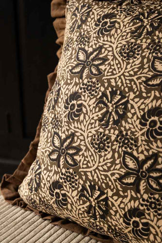 Close-up of the Green Floral Ruffle Edge Cushion styled on a chair.