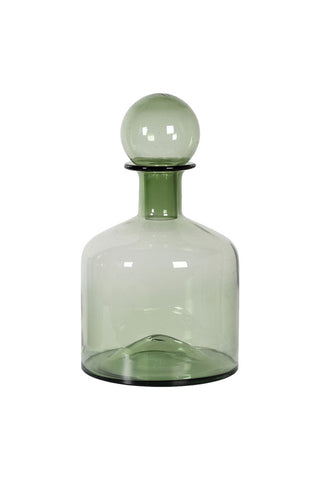 Cutout of the Green Glass Apothecary Bottle on a white background.