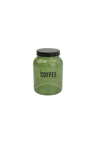 Cutout image of the Green Glass Storage Jar With Black Lid - Coffee on a white background.