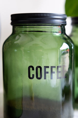 Close-up of the Green Glass Storage Jar With Black Lid - Coffee.