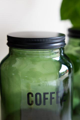 Close-up of the lid of the Green Glass Storage Jar With Black Lid - Coffee.