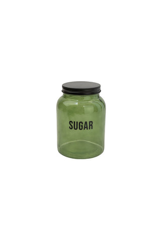 Cutout image of the Green Glass Storage Jar With Black Lid - Sugar on a white background.