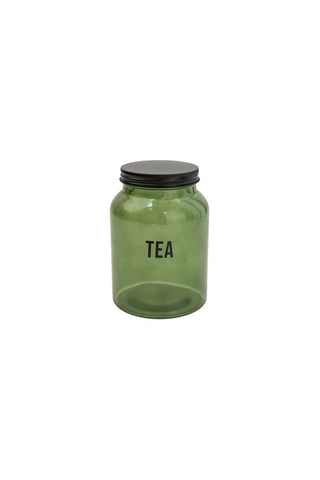 Cutout image of the Green Glass Storage Jar With Black Lid - Tea on a white background.