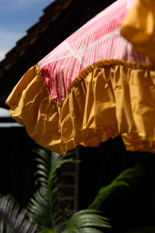 Close-up of the fringe of the HKliving Pink Linear Parasol with Mustard Fringe.