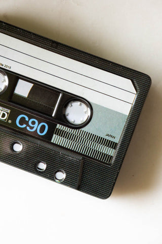 Detail shot of the Happy Birthday Cassette Tape Storage Tin styled on a white surface.