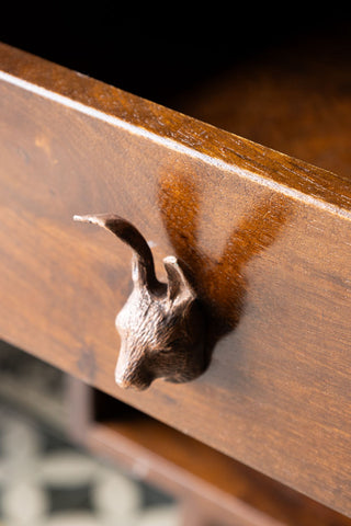 Close-up of the Hare Head Cupboard/Drawer Knob on a wooden drawer, seen from above.