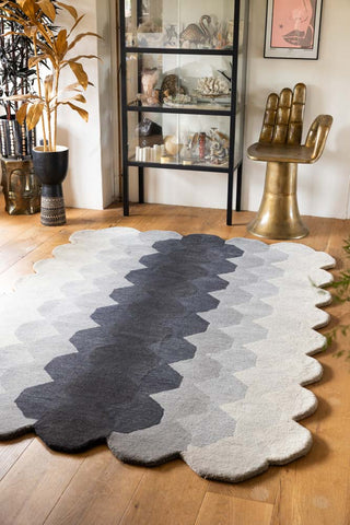 The Hexagonal Ombre Rug styled on a living room floor.