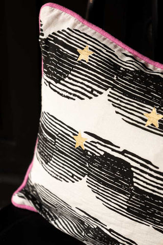 Close-up of the Hot Pink & Gold Star Print Reversible Cushion.