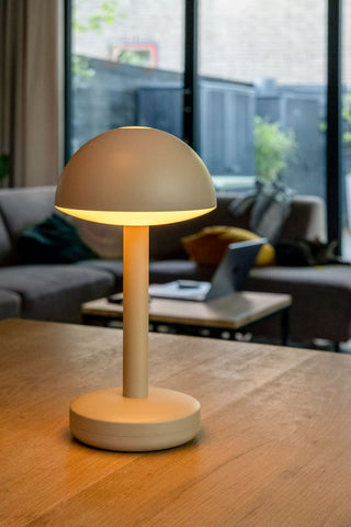 The Humble - Domed Cable-Free Mood Lighting in Off White displayed on a wooden table.