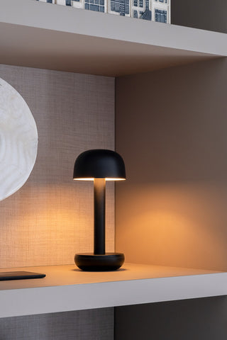 The Humble - Elegant Cable-Free Mood Lighting - Black displayed on a shelf.