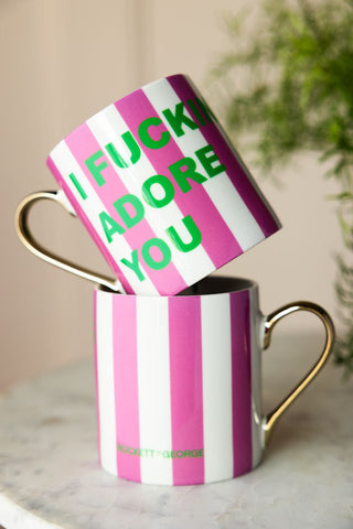 Two of the I Fucking Adore You Stripe Mugs styled with one on top of the other.