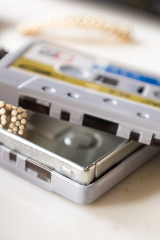 Close-up of the I Made You A Mix Tape Cassette Tape Storage Tin with the lid off.