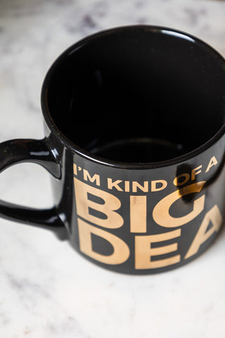 The I'm Kind Of A Big Deal Mug on a white marble surface, seen from above.