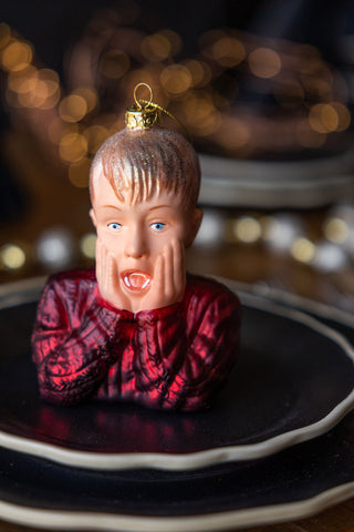 The Kevin Inspired Christmas Tree Decoration styled on two black plates on a Christmas table.