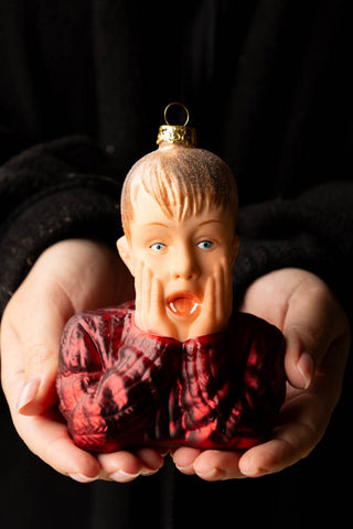 The Kevin Inspired Christmas Tree Decoration being held in a model's hands.