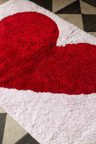 Close-up shot of the LOVE Tufted Cotton Bath Mat.