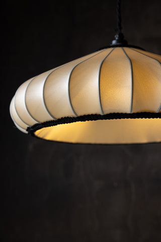 Close-up of the Lantern Style Flush Easyfit Light Shade in front of a dark background, with the light inside switched on.