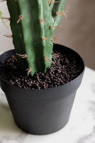 Close-up of the black pot of the Large Faux Cactus Plant.