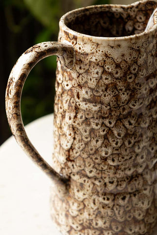 Close-up of the handle of the Large Mottled Brown Jug.